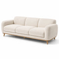 Canapé trois places en tissu bouclé beige avec pieds en bois