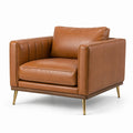 Fauteuil en cuir avec pieds en métal doré